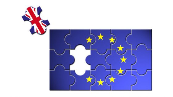 UK puzzle piece coming out of EU flag to represent Brexit