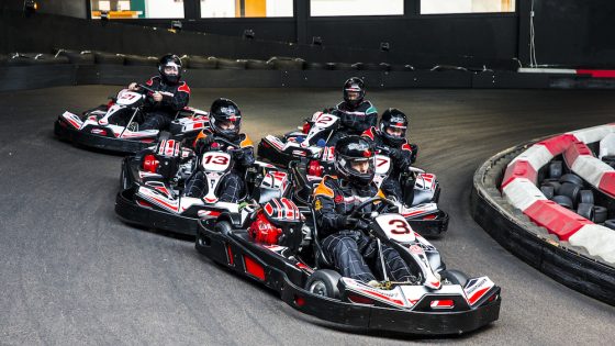 A team on the track at TeamSport Indoor Karting