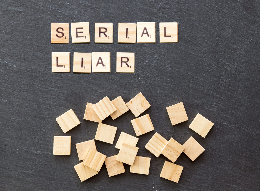 Scrabble letters spelling out the words 'serial liar'