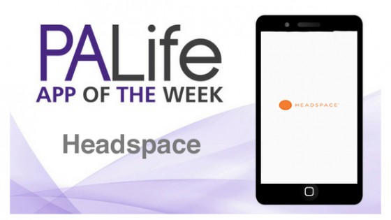 A phone that shows the Headspace logo