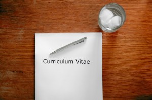 CV on a table with a pen