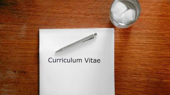 CV on a table with a pen
