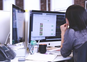 Woman on a desktop looking into communication