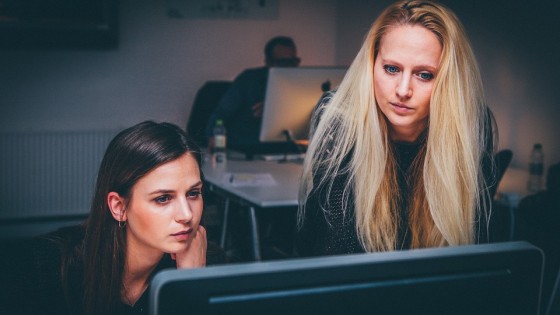 Two ladies looking at a computer screen