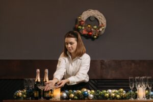 woman setting a table for Christmas event