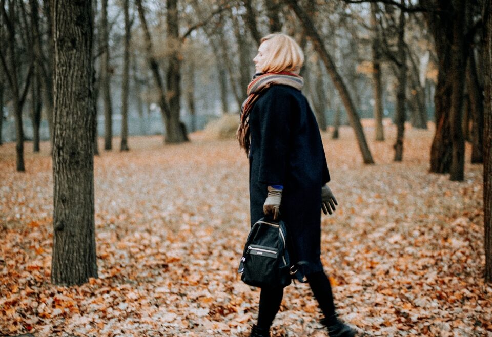 Person on a walk: Professional taking a mindful break outdoors.