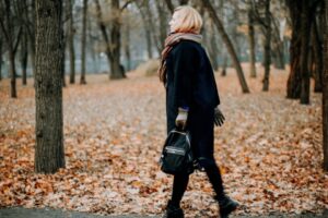 Person on a walk: Professional taking a mindful break outdoors.