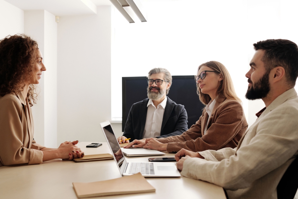 People in the office chatting and being happy