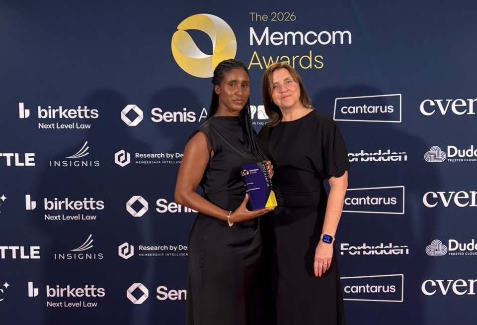 two women collecting awards